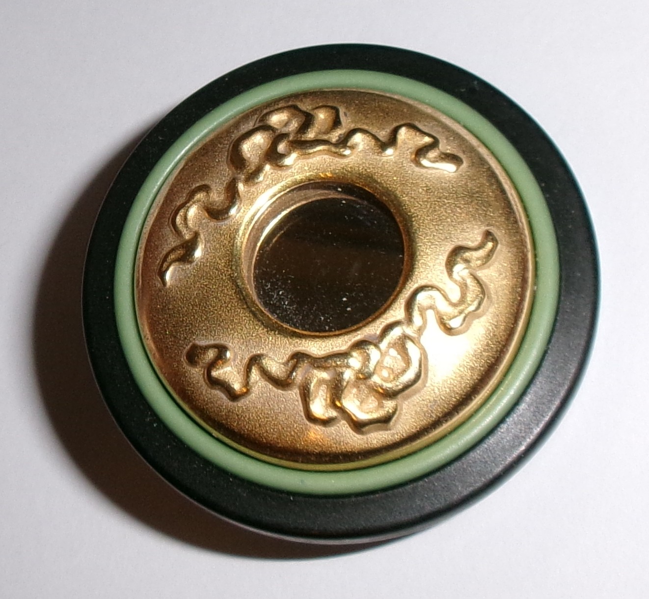 Black & gold ornate shank button with sage ring and mirrored center