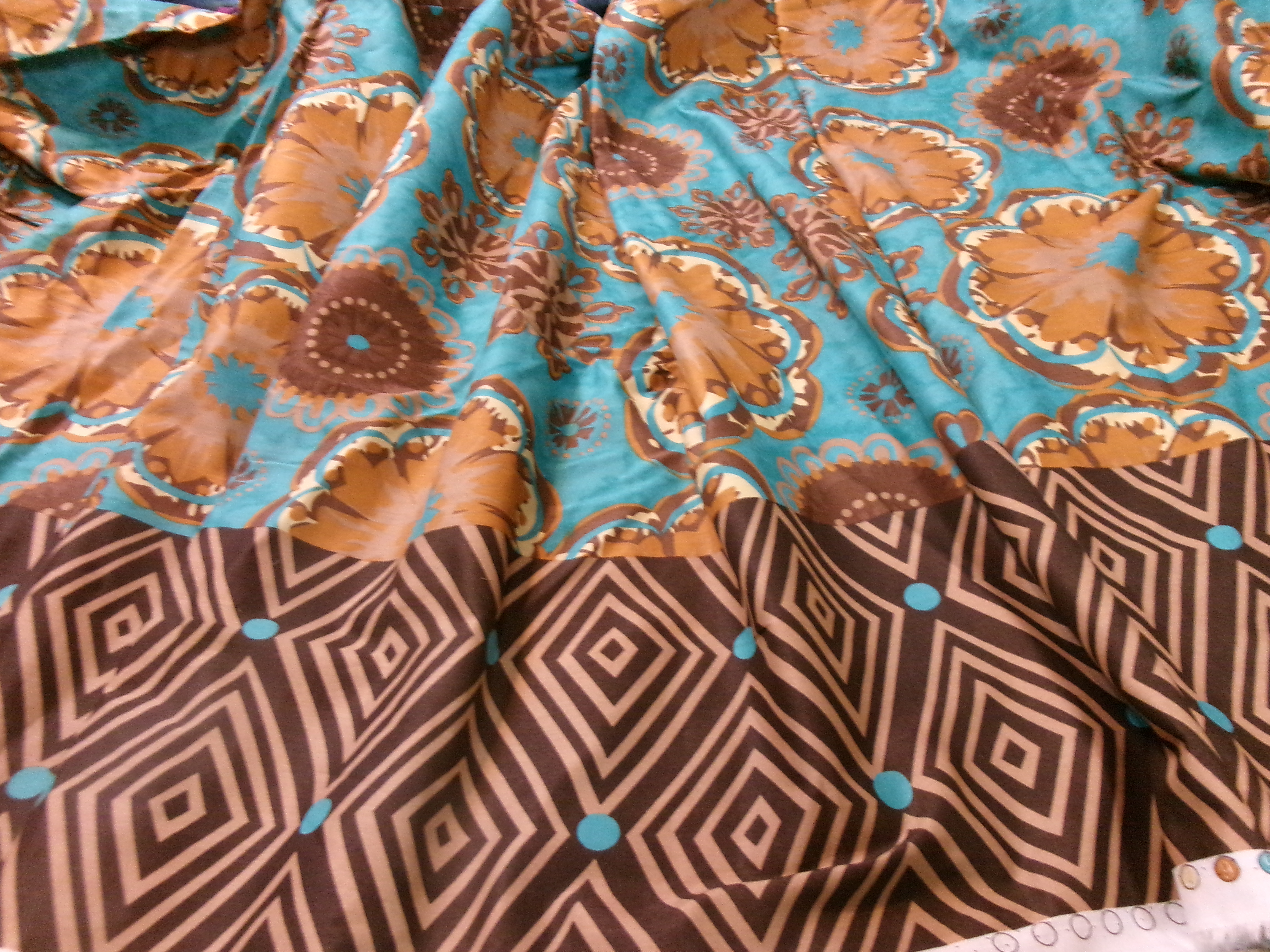 Batik print border print in teal, browns